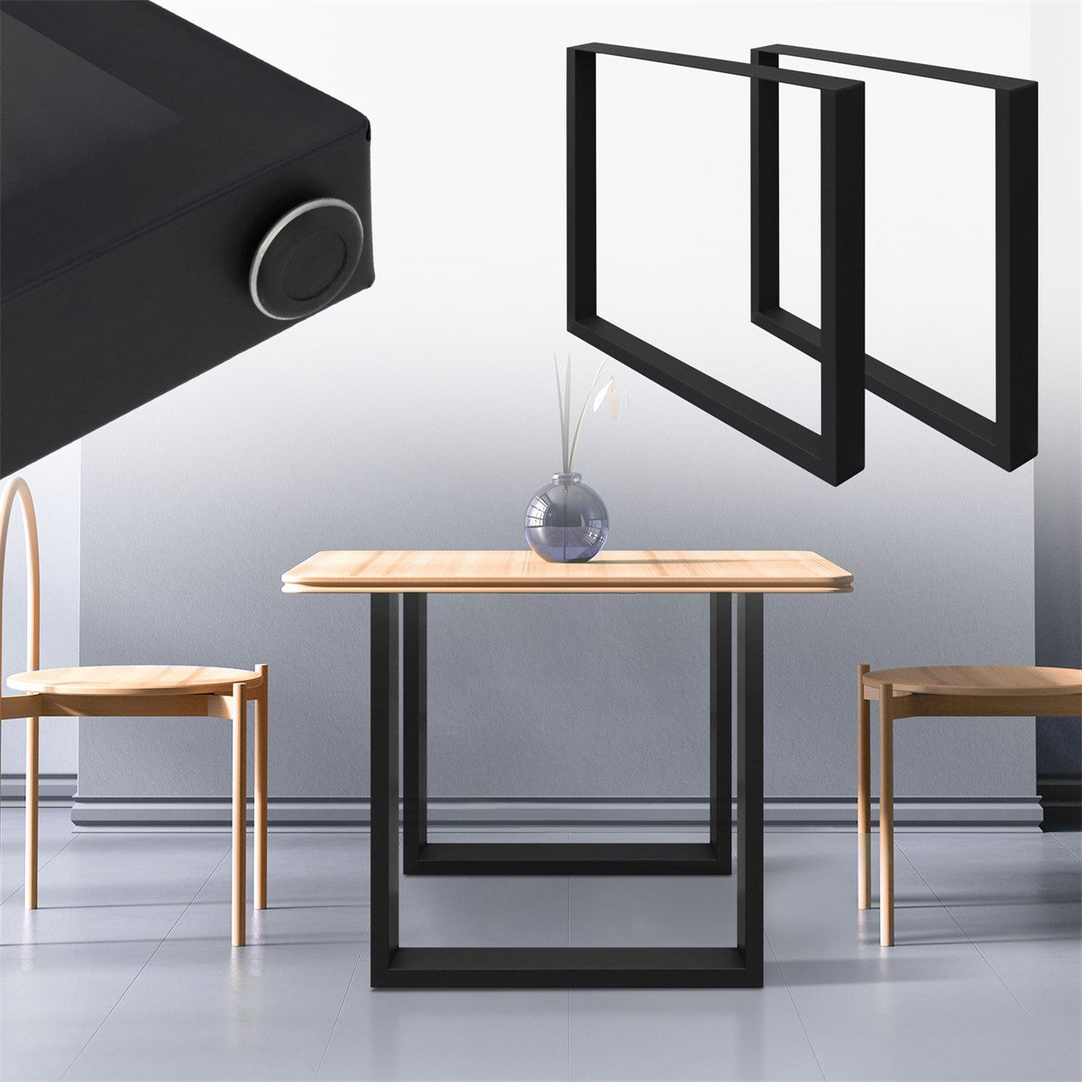 A table with a wooden top and black metal legs, two chairs in the background.