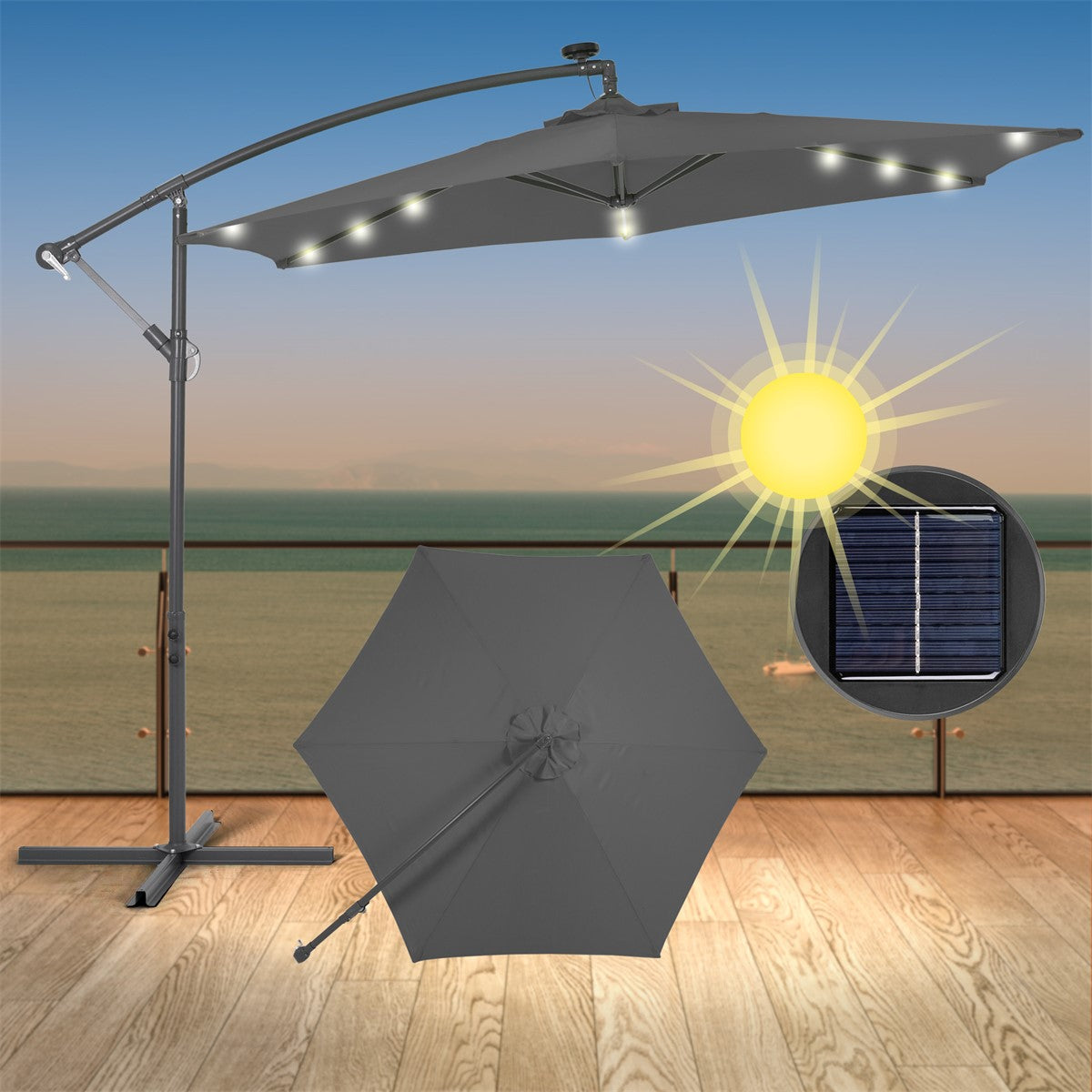 Ombrellone grigio con illuminazione LED su una terrazza con vista sul mare.