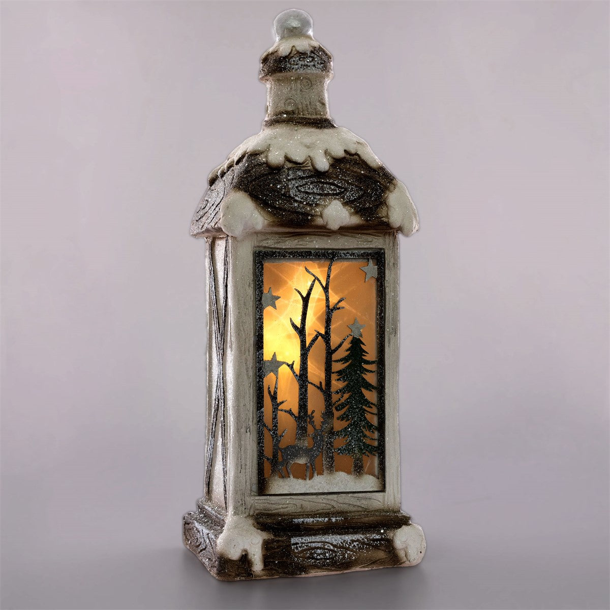 Lanterna decorativa con motivo invernale e interno illuminato.