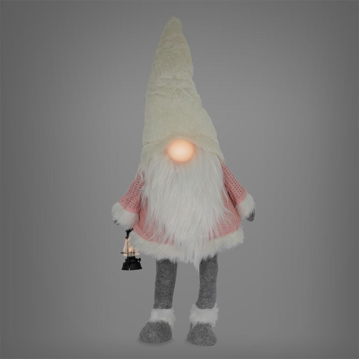 Figurine en peluche d’un gnome avec une barbe blanche et une lanterne.