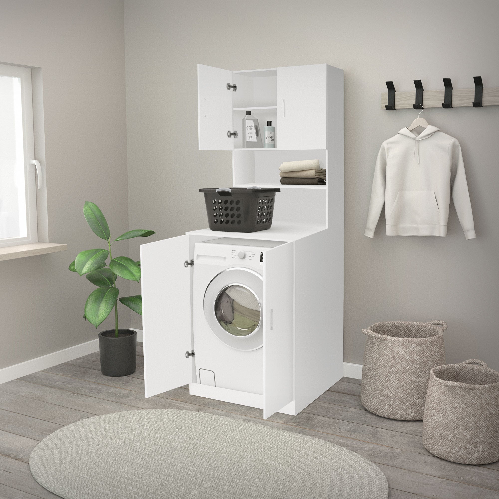 Wasmachineonderkast met wasmand en planten in de kamer.