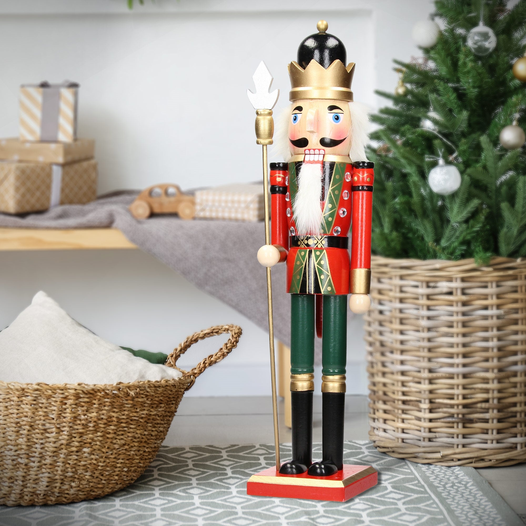 Nutcracker figure stands next to a basket and gifts.