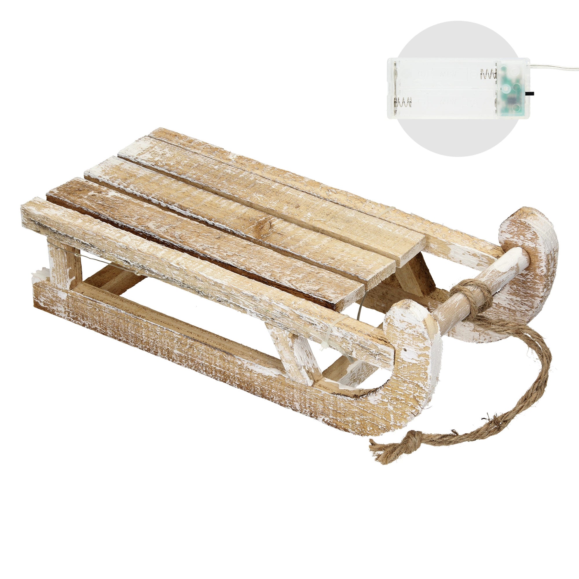 Eine Holzschlitten mit Seil, daneben eine kleine Batteriebox.
