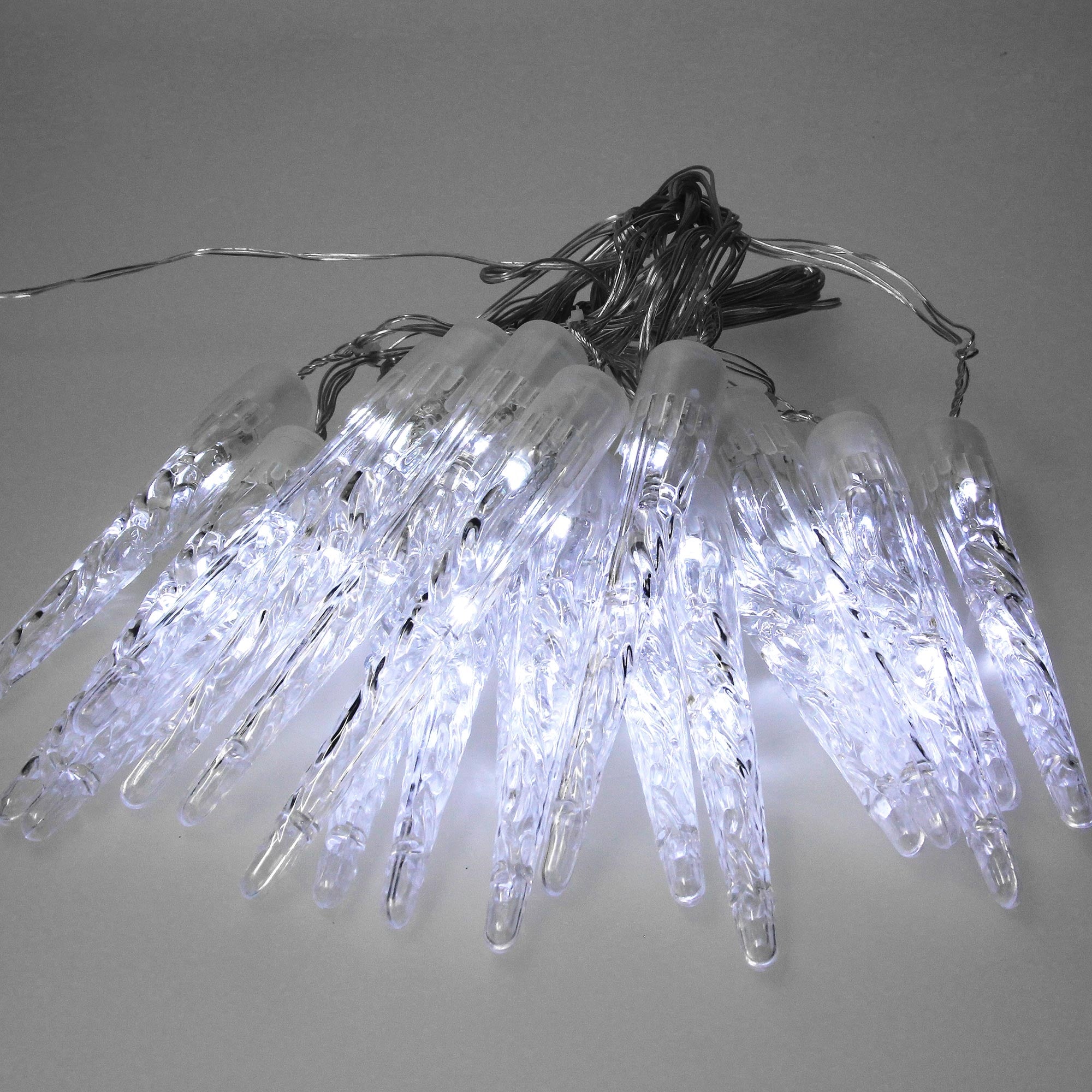 Close-up of a string of lights with glowing, clear lights.