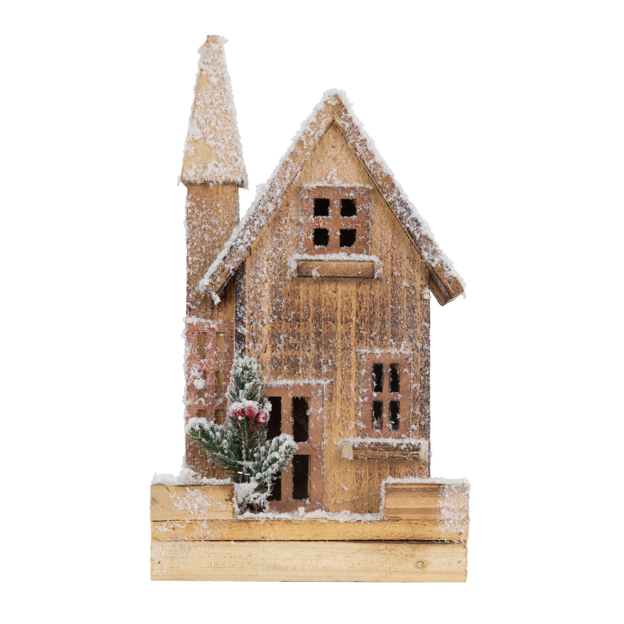 Maison en bois avec de la neige, fenêtres et porte, petite plante avec des baies rouges.