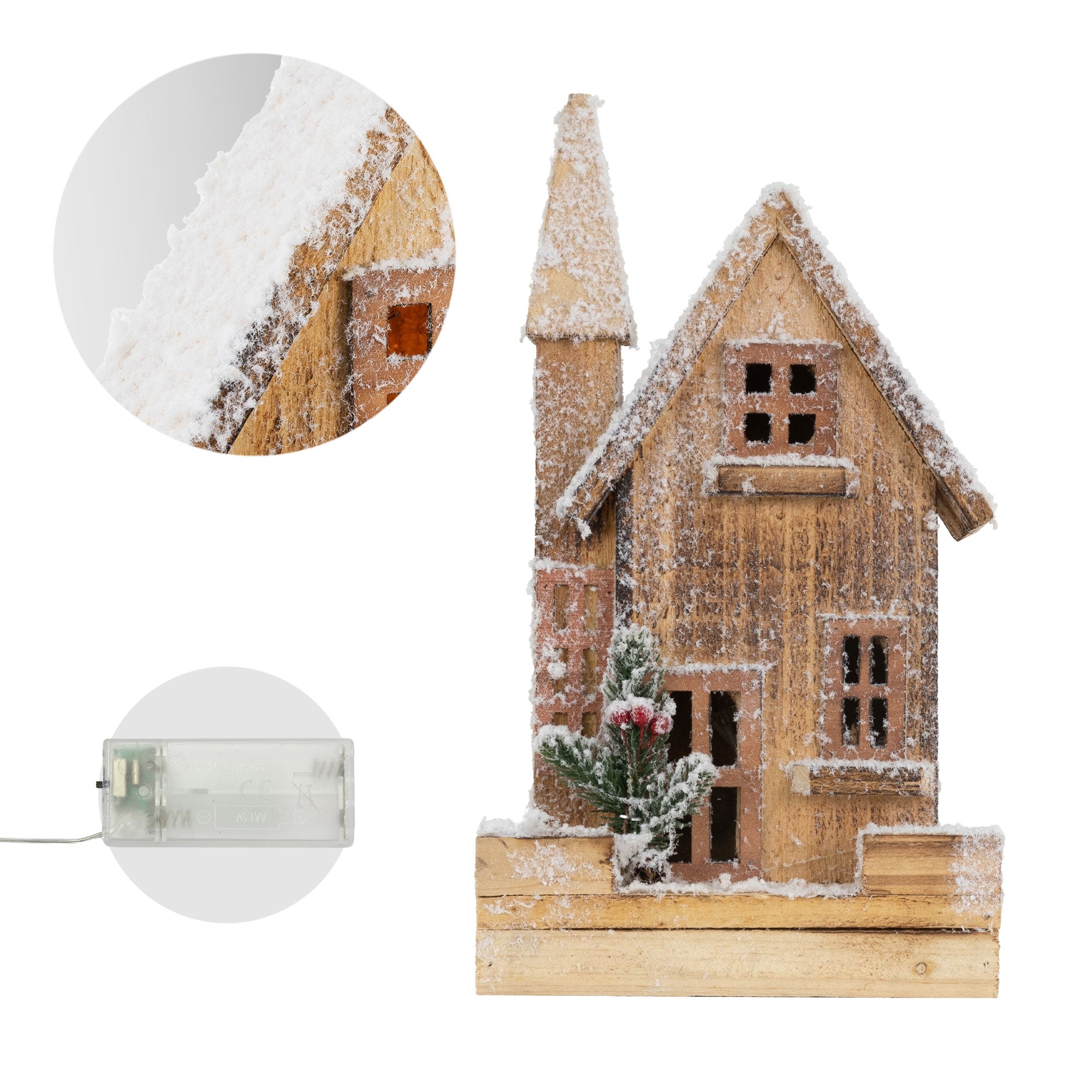 Maison en bois avec de la neige, des fenêtres et une porte, décorée avec un petit arbre.