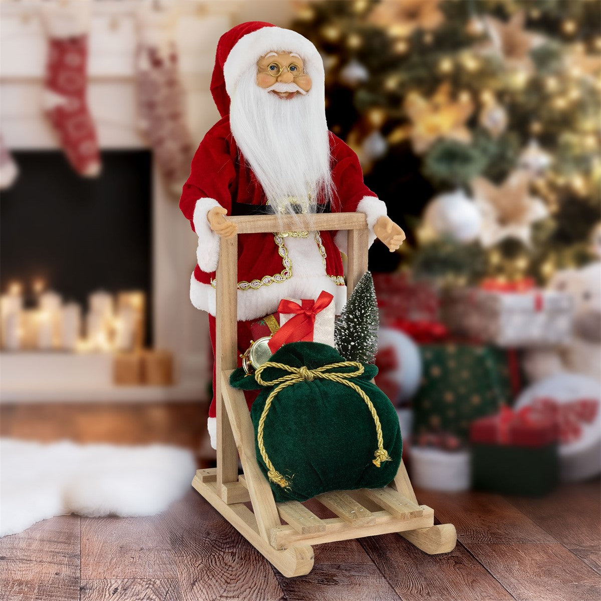 Vánoční figurka Santa Clause na saních s dárky.