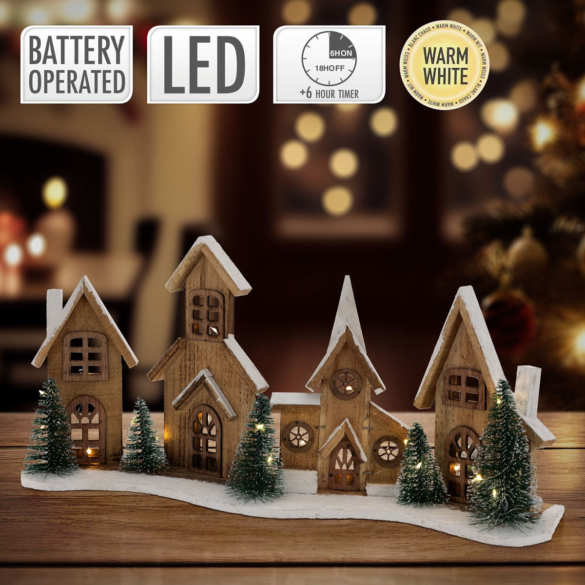 Holzhäuser mit LED-Beleuchtung, warmweiß, auf einem Tisch.