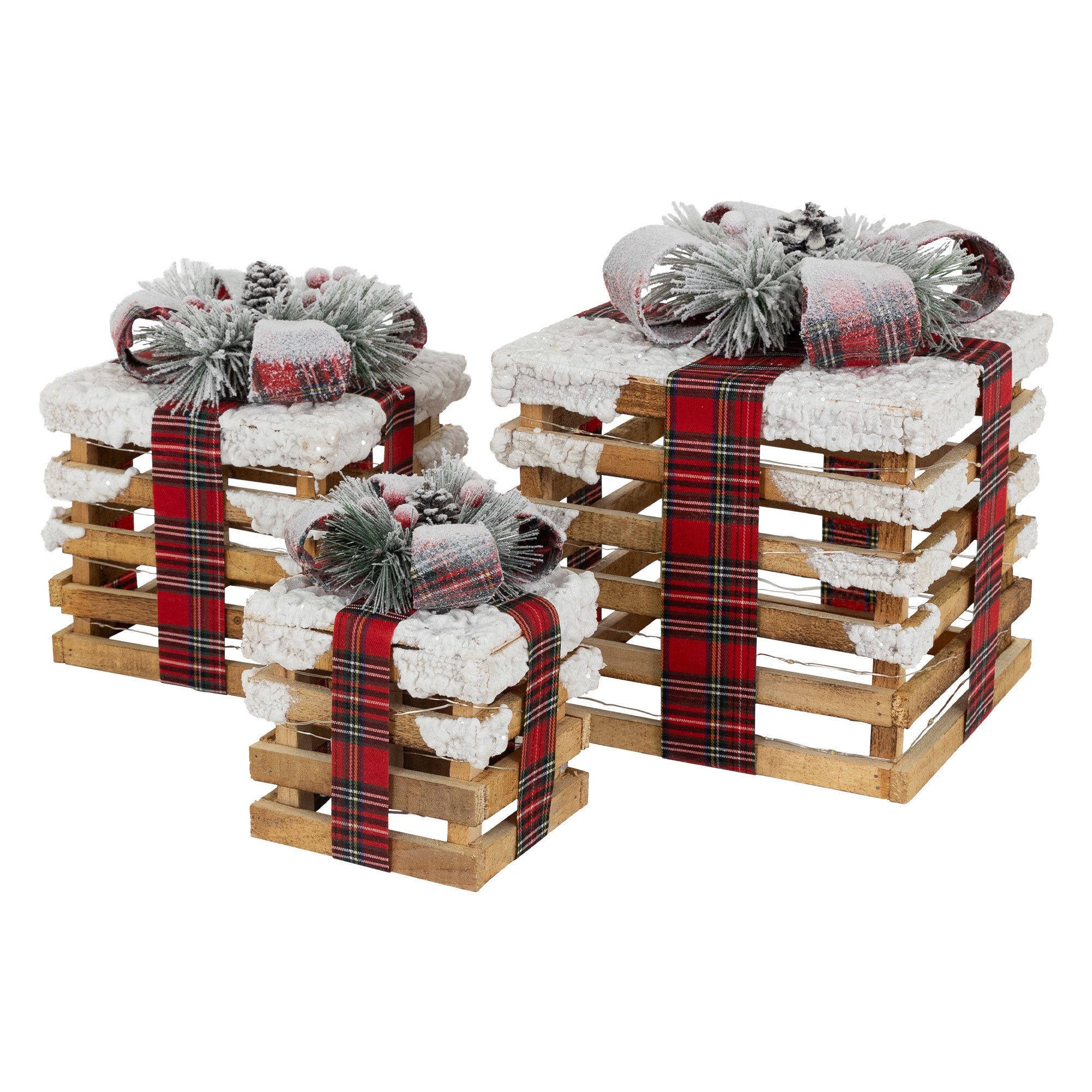Drei Geschenkkörbe mit Dekoration und rotem Band.