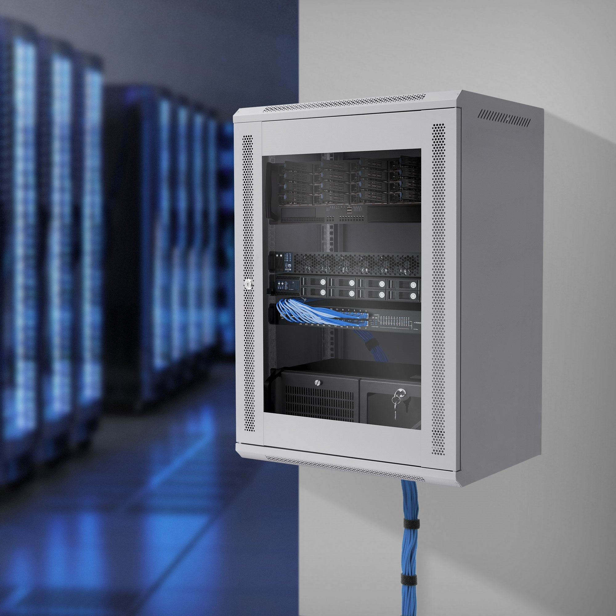 White server cabinet in a room with blue lights, cables visible.