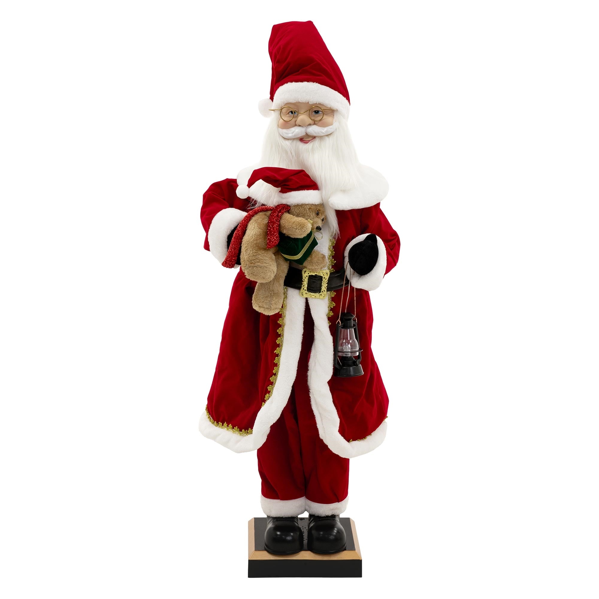 Lebensgroße Weihnachtsmannfigur mit rotem Mantel und Teddybär.