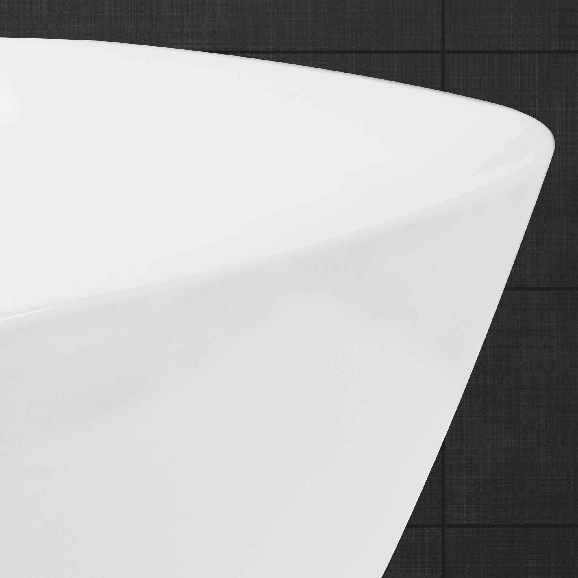 Detailopname van de rand van een witte wastafel.