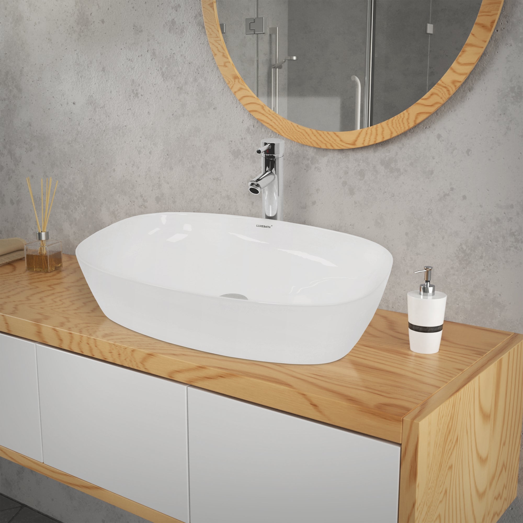 Transparent washbasin on a wooden shelf in front of a gray wall.