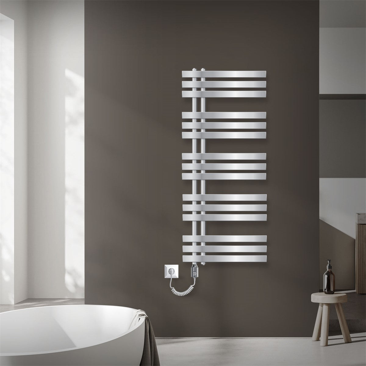 A vertical towel radiator in chrome on a wall.