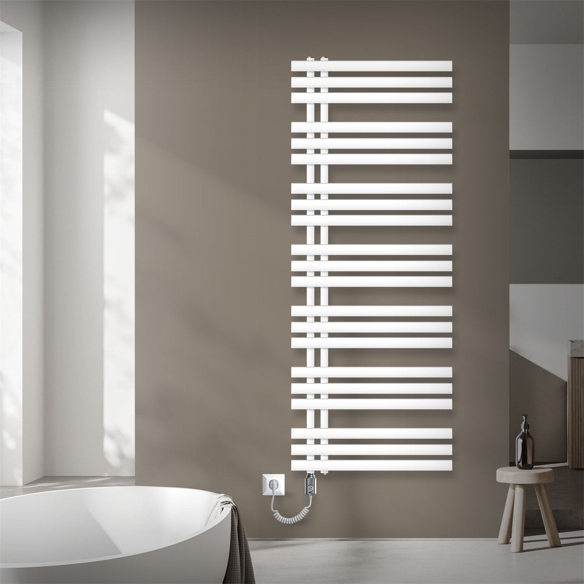 White radiator with an electrical connection on a wall.