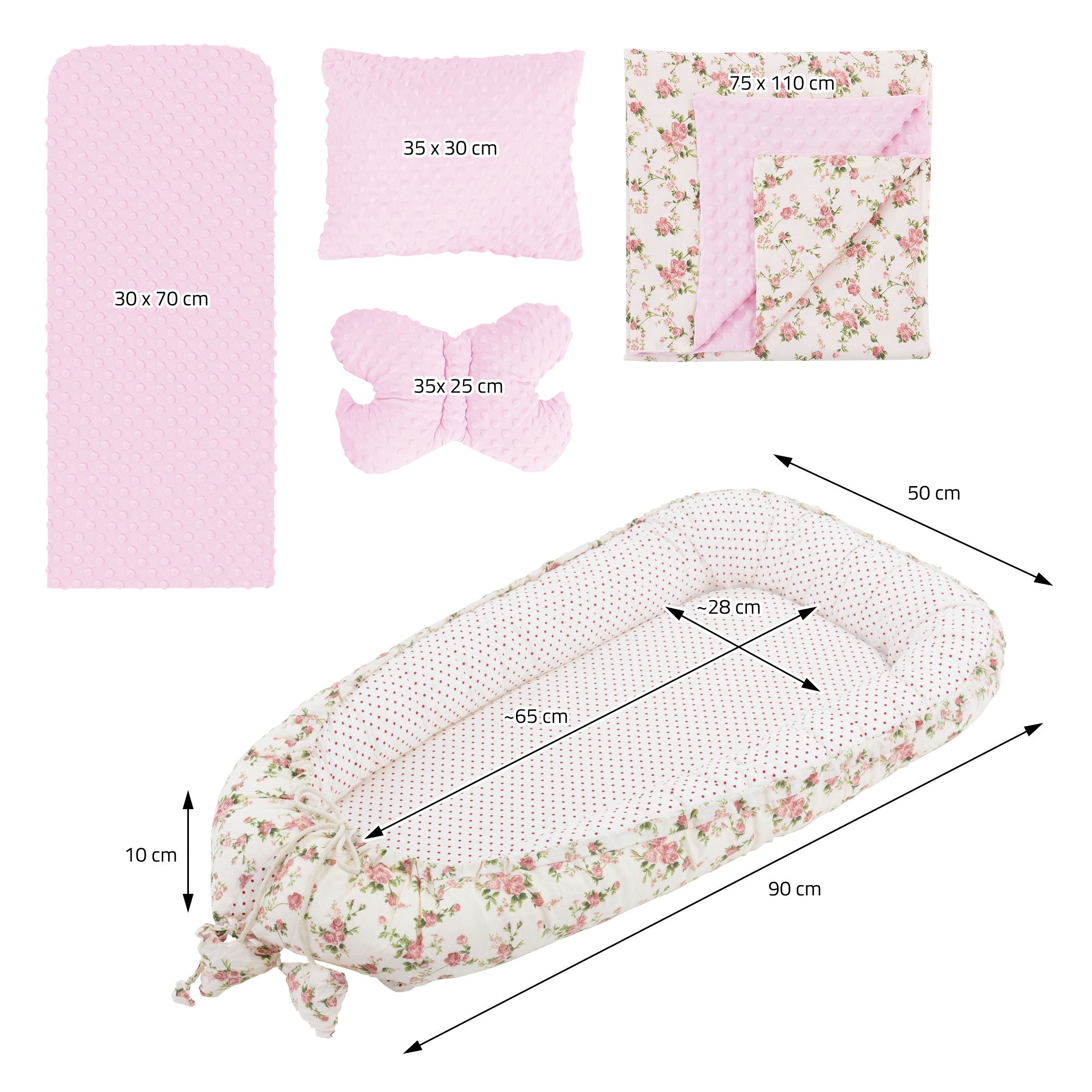 Anordnung von Baby Nest Zubehör mit Maßen in cm, auf rosa und blumigem Hintergrund.
