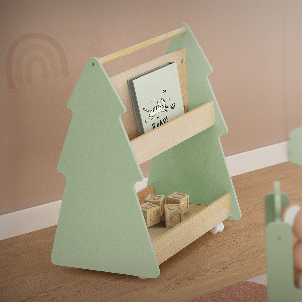 Wooden shelf in the shape of a tree, filled with books and toys.