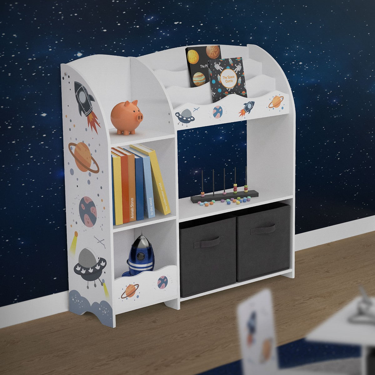 Shelf with a space motif, bookcase and two black boxes.
