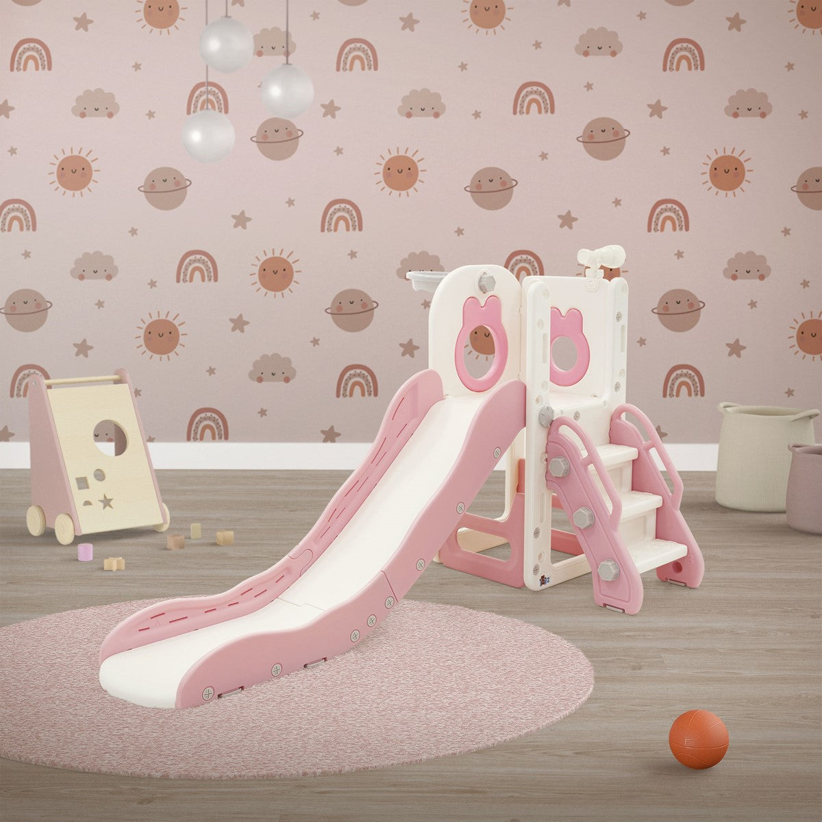 Kinderrutsche mit Treppe und pinken Akzenten in einem Raum mit buntem Wanddesign.