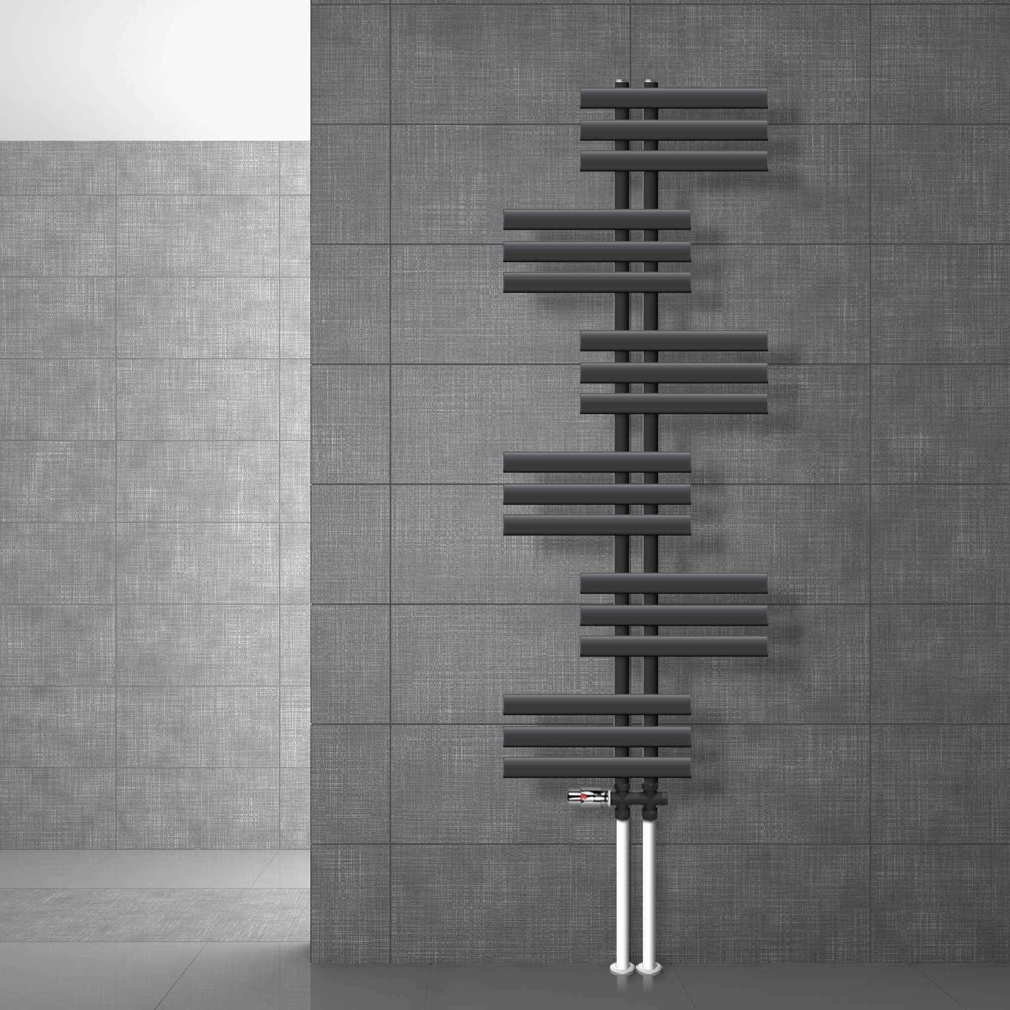 Anthracite radiator on a gray wall.