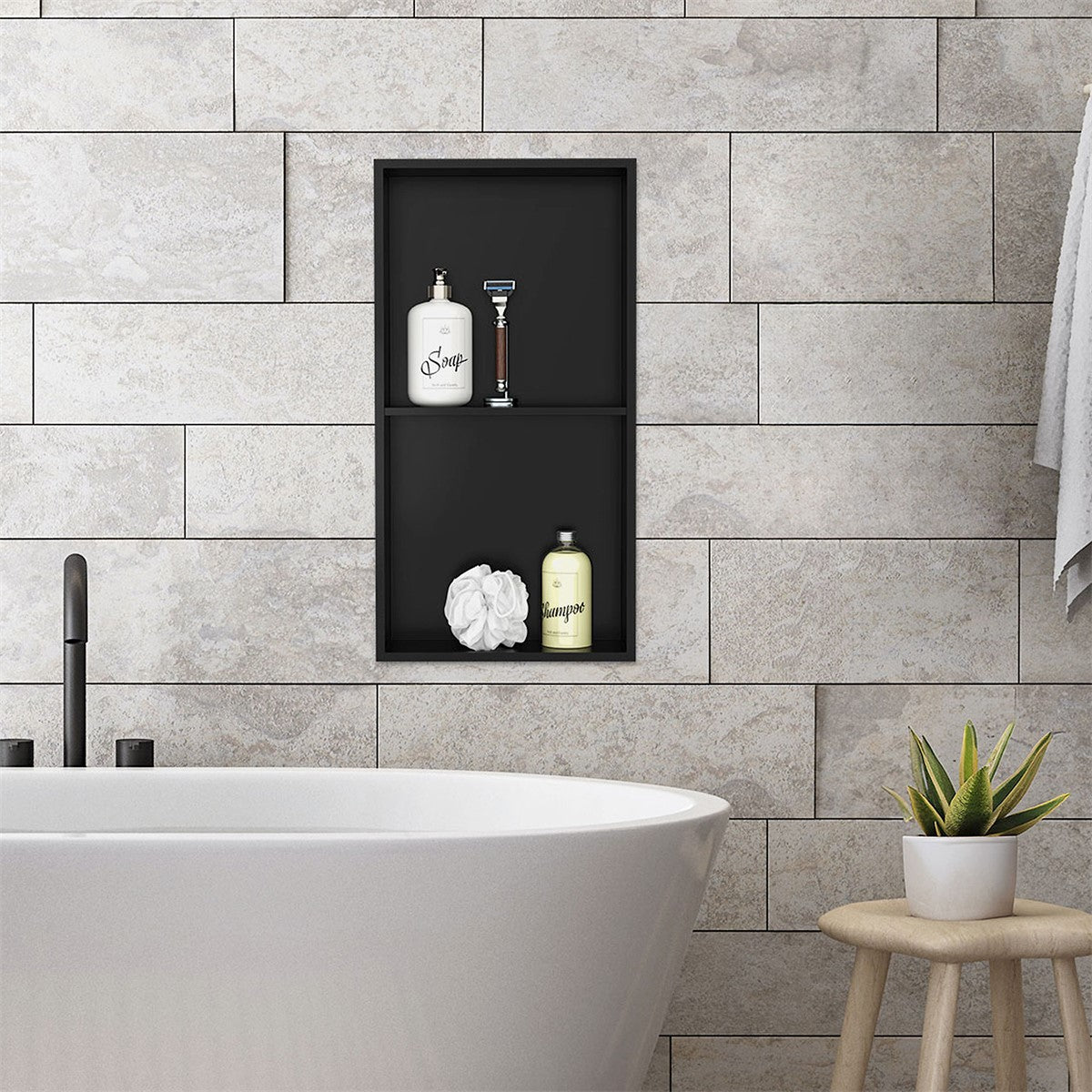 Bathroom with a freestanding bathtub and a wall shelf with personal care products.