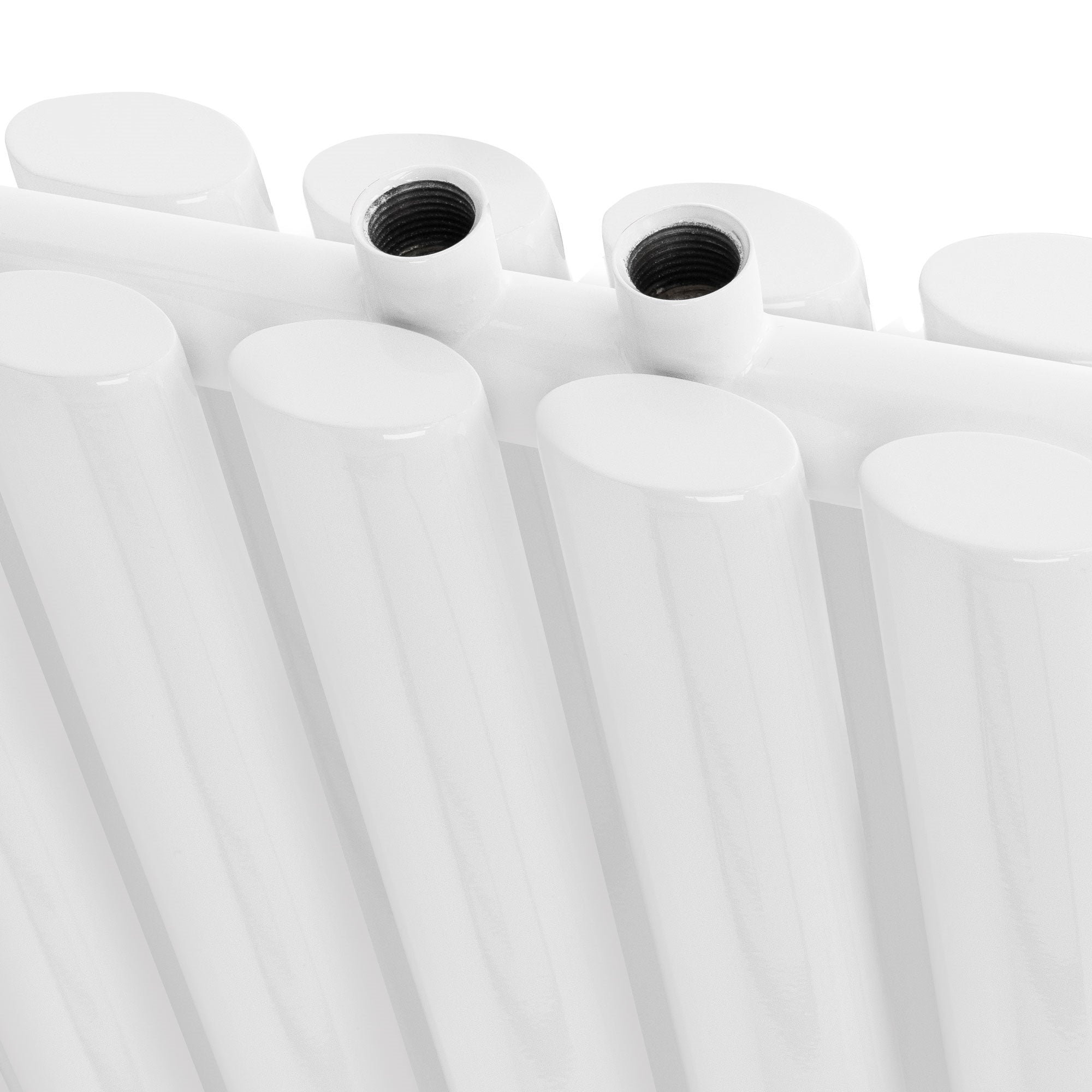 Close-up of a white radiator with two connections.