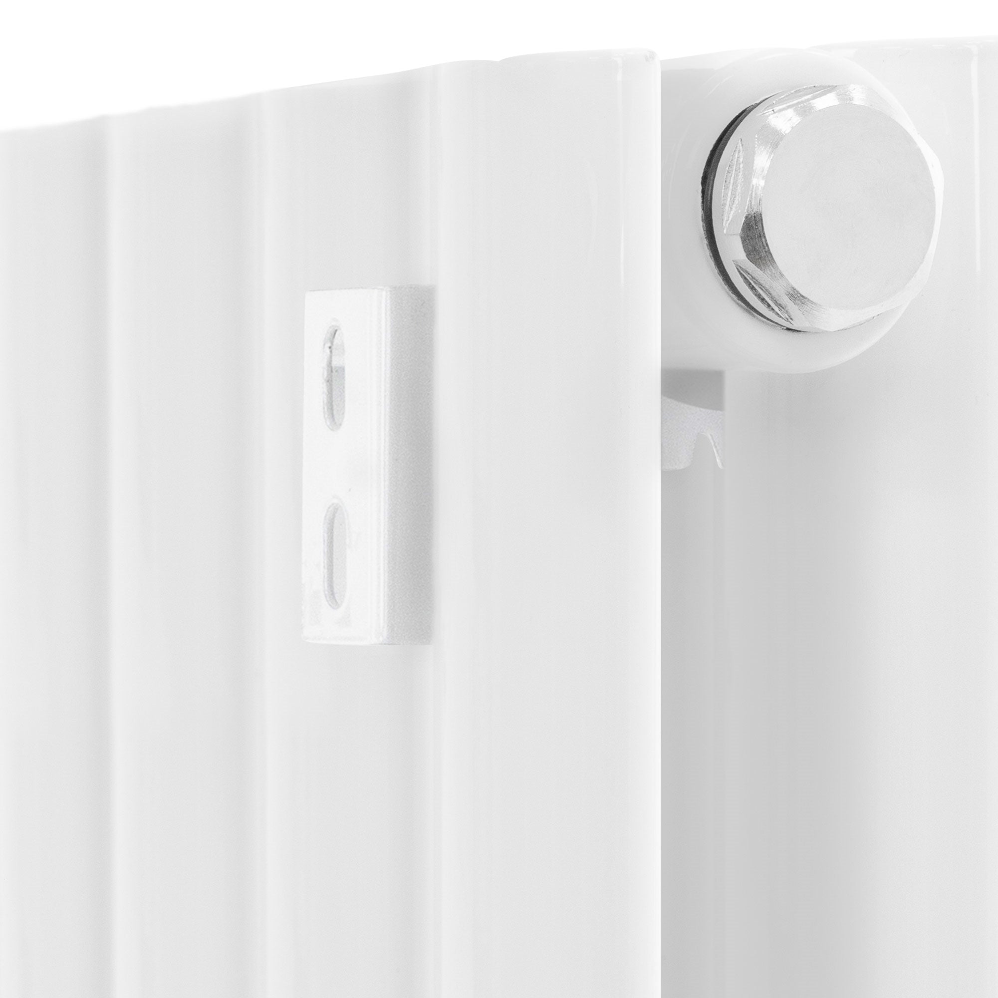 Close-up of a white radiator with connection.