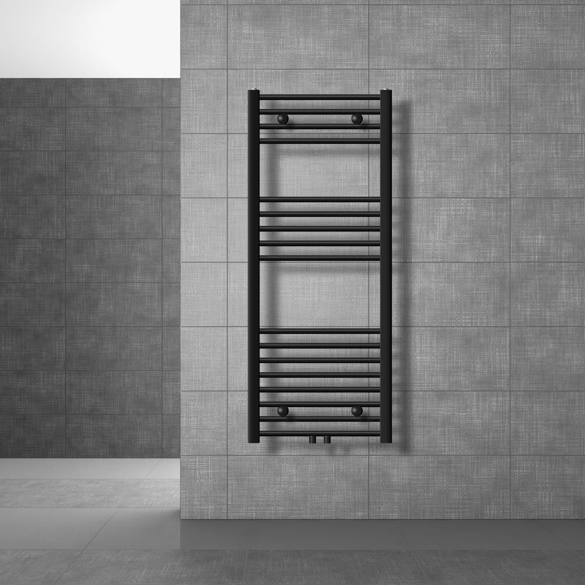 Black towel radiator on a gray wall.