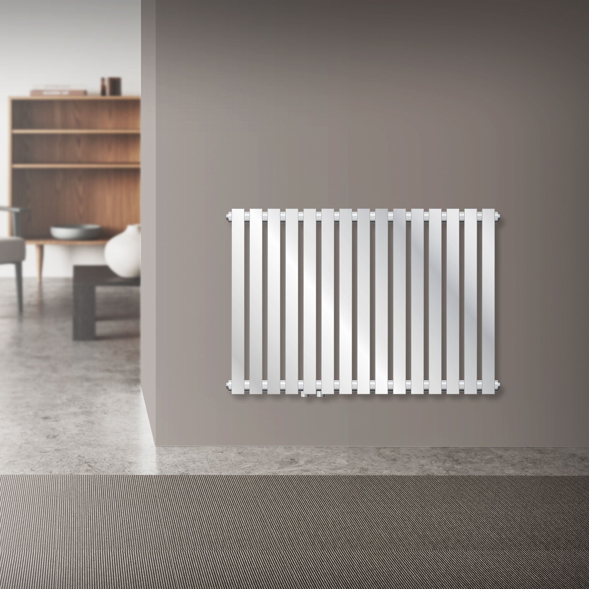 Bright horizontal radiator made of chrome with narrow fins.