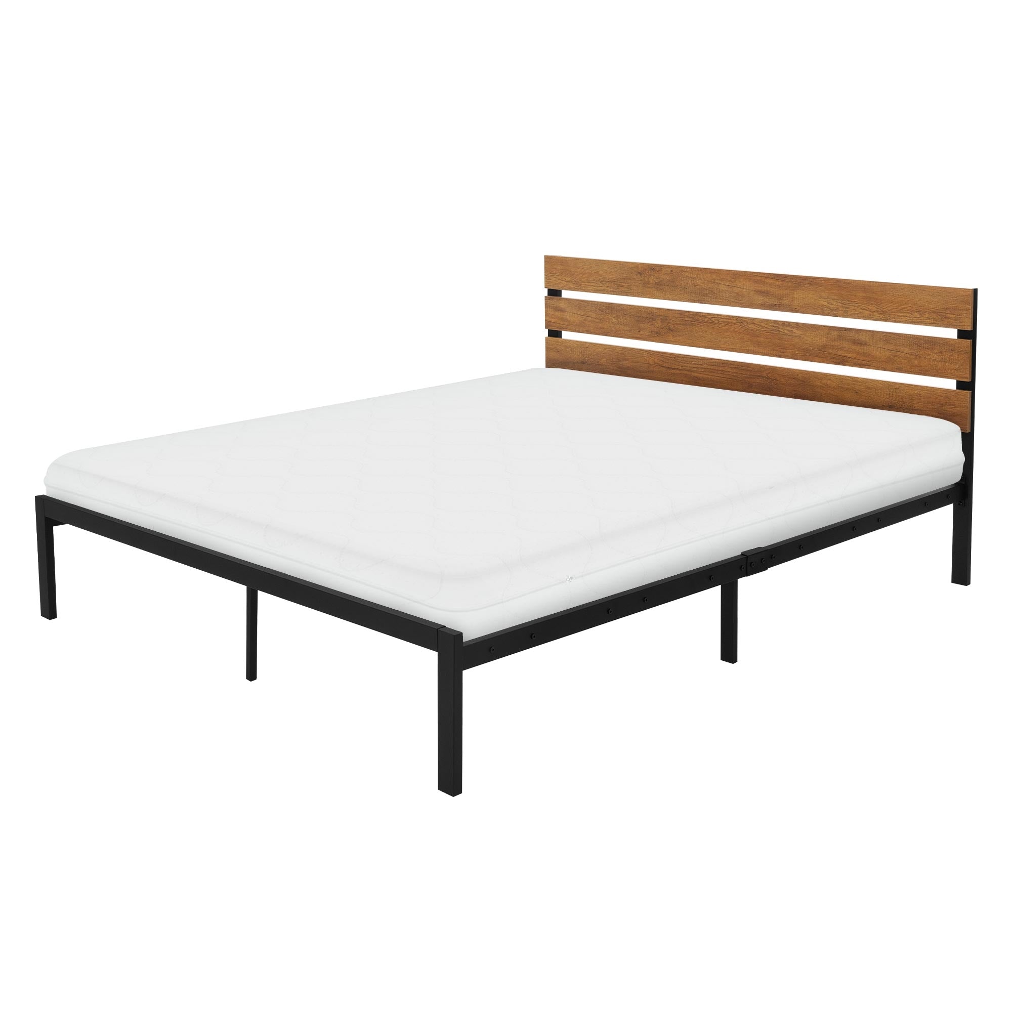 Letto matrimoniale con materasso e testiera in legno su un tappeto.