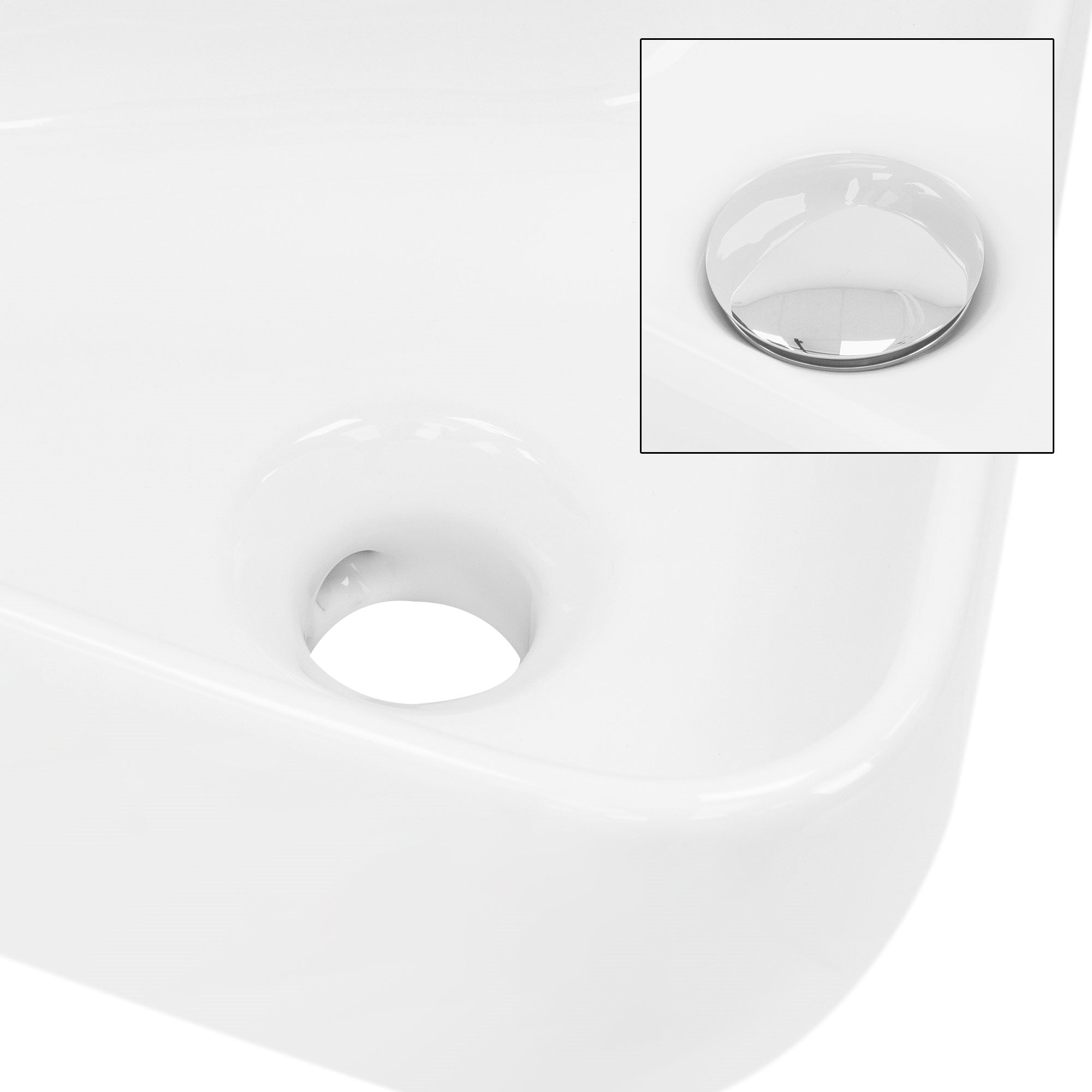 Weißes Waschbecken mit Abflussloch und verchromtem Abdeckstopfen.