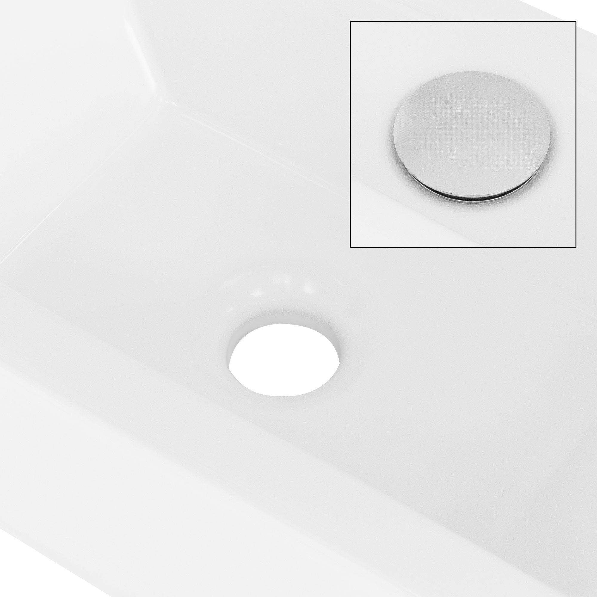Lähikuva pesuallasta, jossa on viemäriaukko.
