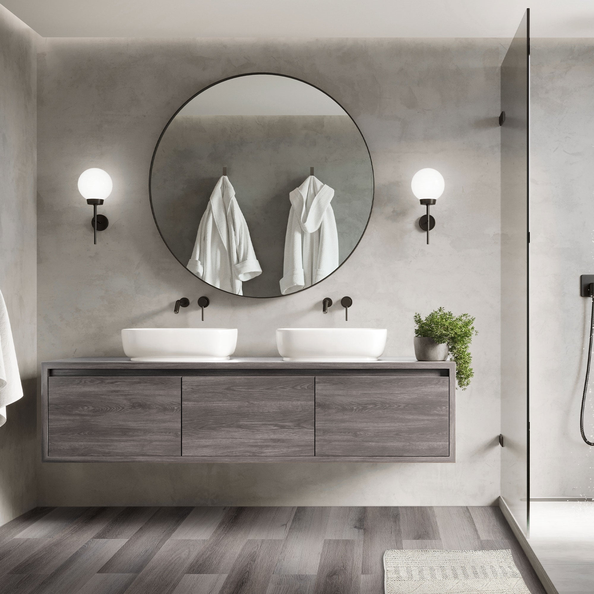Ein modernes Badezimmer mit zwei Waschbecken und Handtüchern an der Wand.