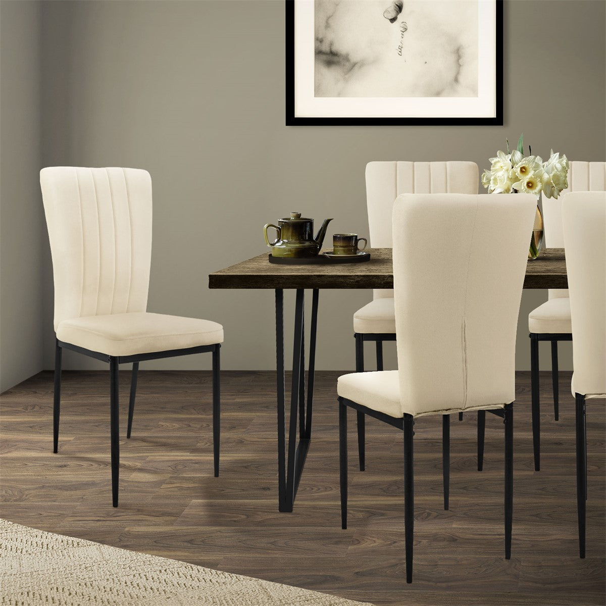 A dining room with a table and six chairs in light-colored fabric.