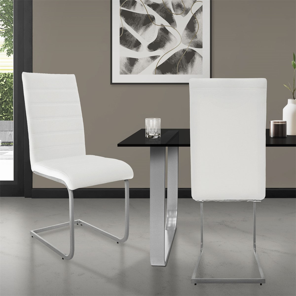 Two white chairs at a black table in a modern room.
