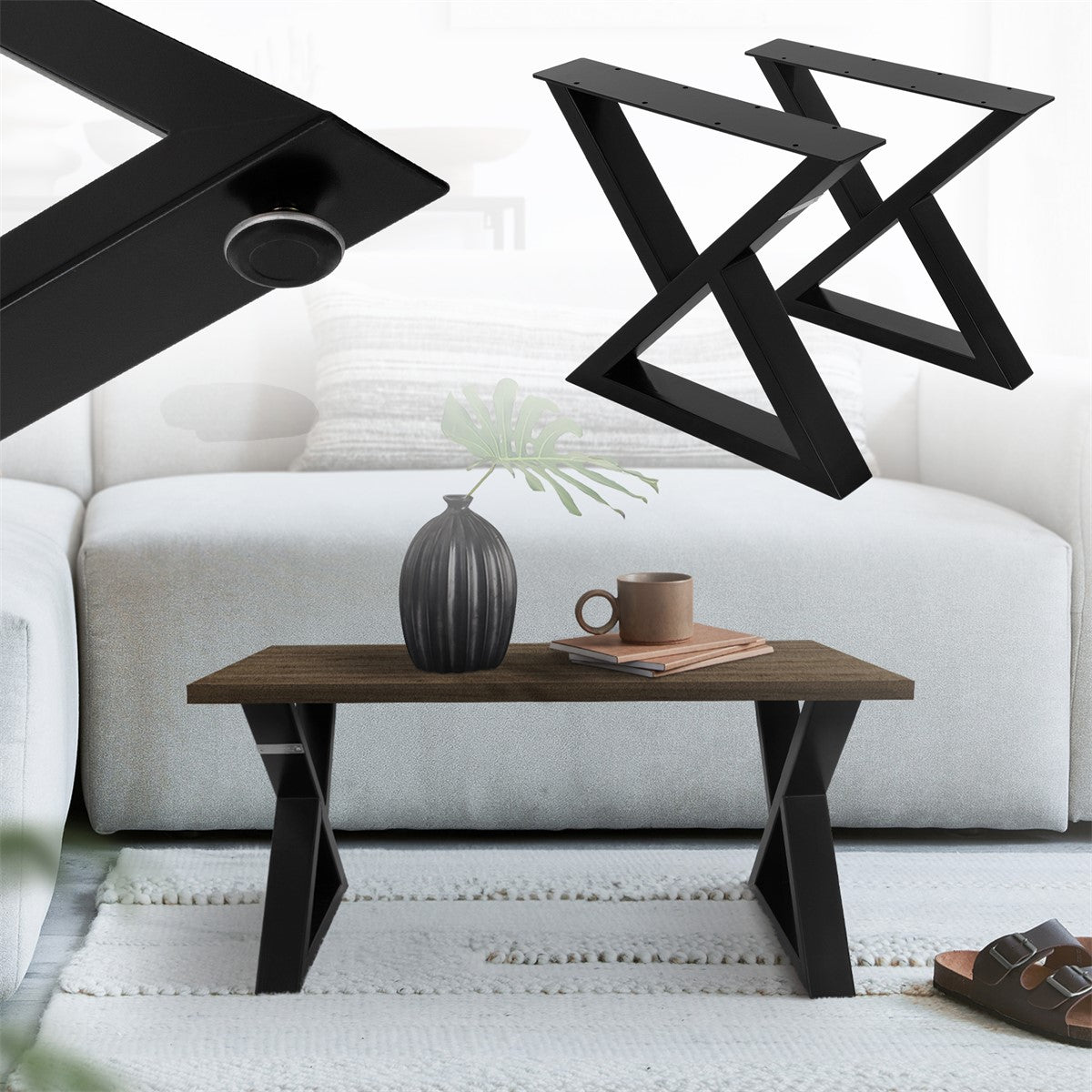 Tavolo nero con struttura a X, decorato con un vaso.
