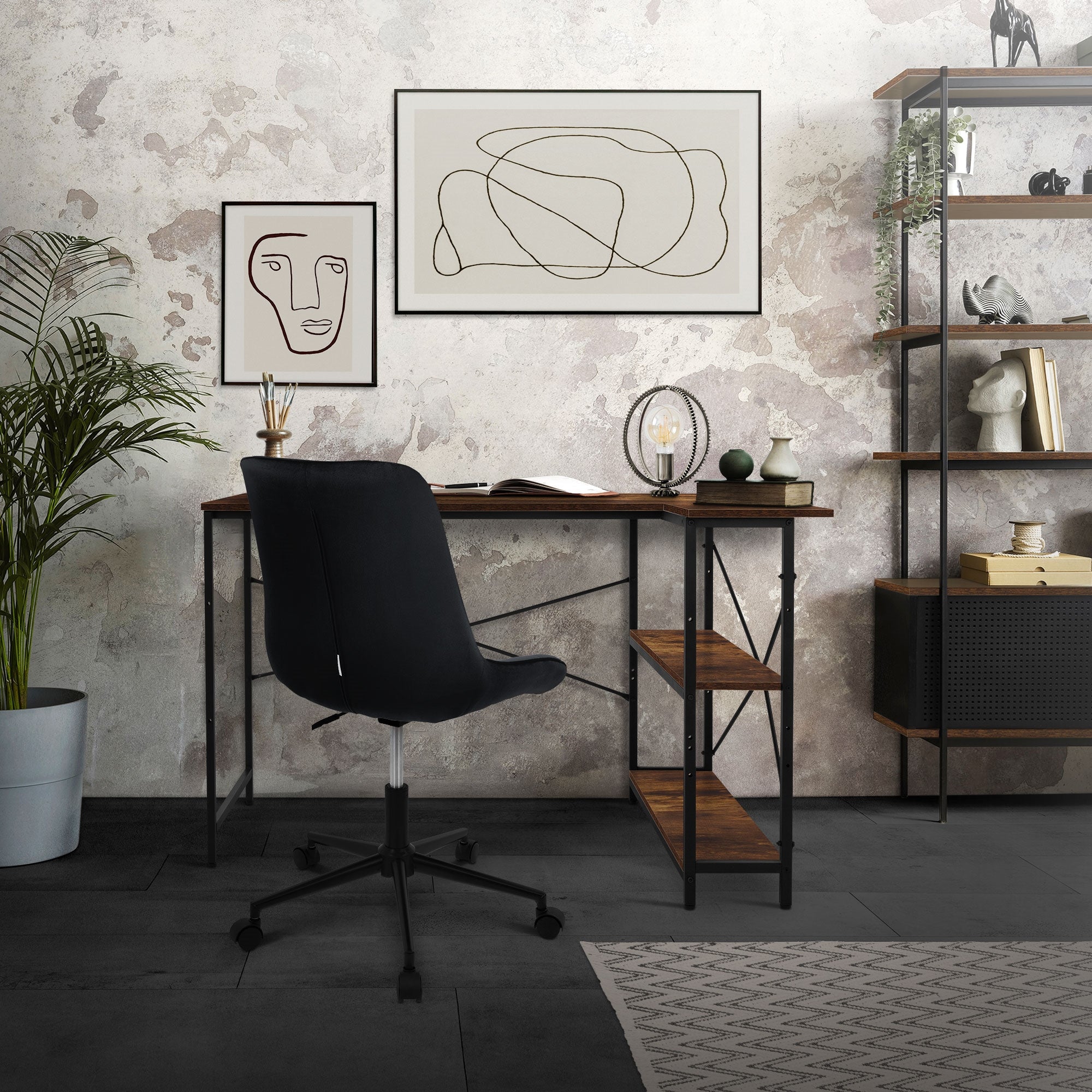A desk with a chair, plants, and minimalist pictures in a modern room.