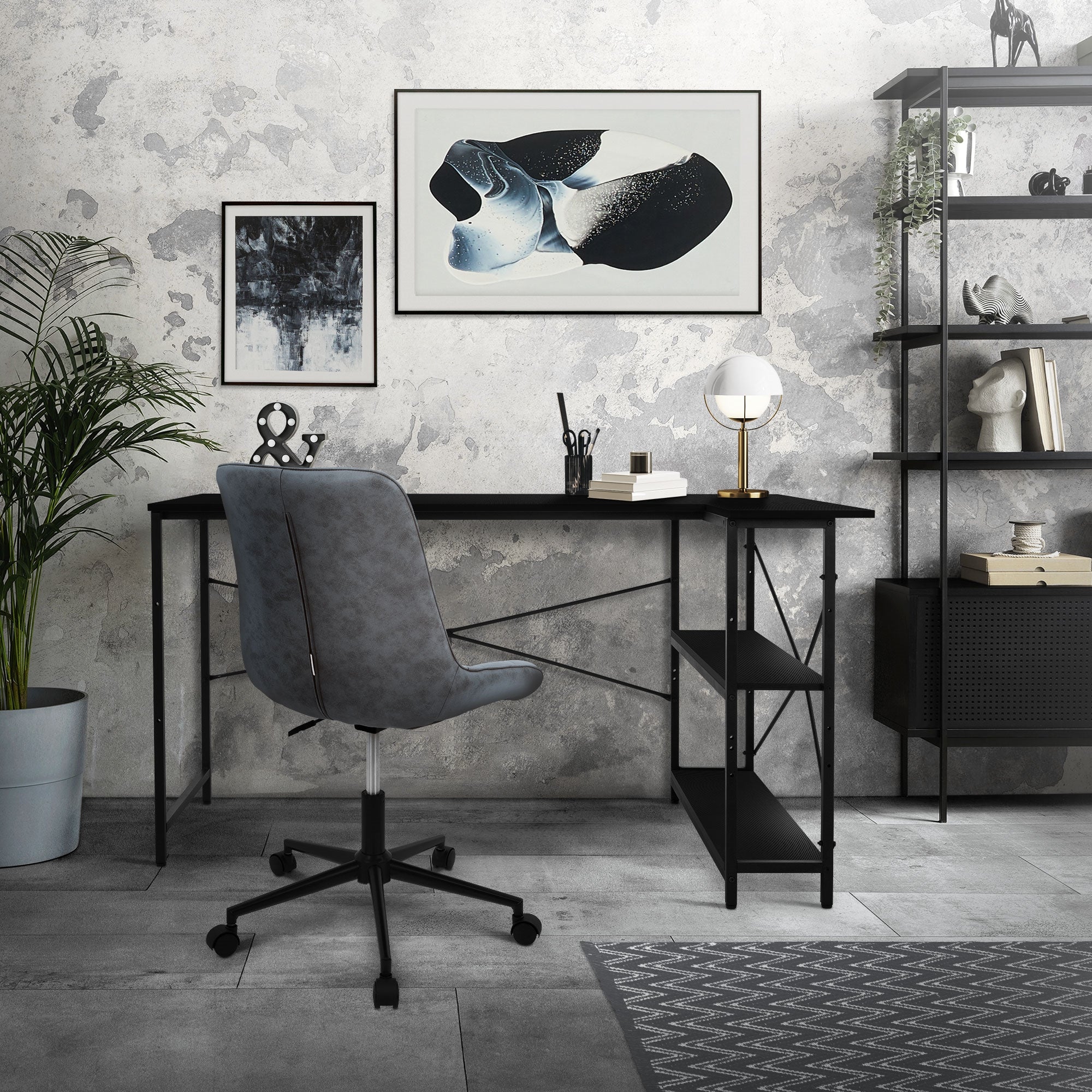 A modern desk with chair, plants, and pictures on the wall.
