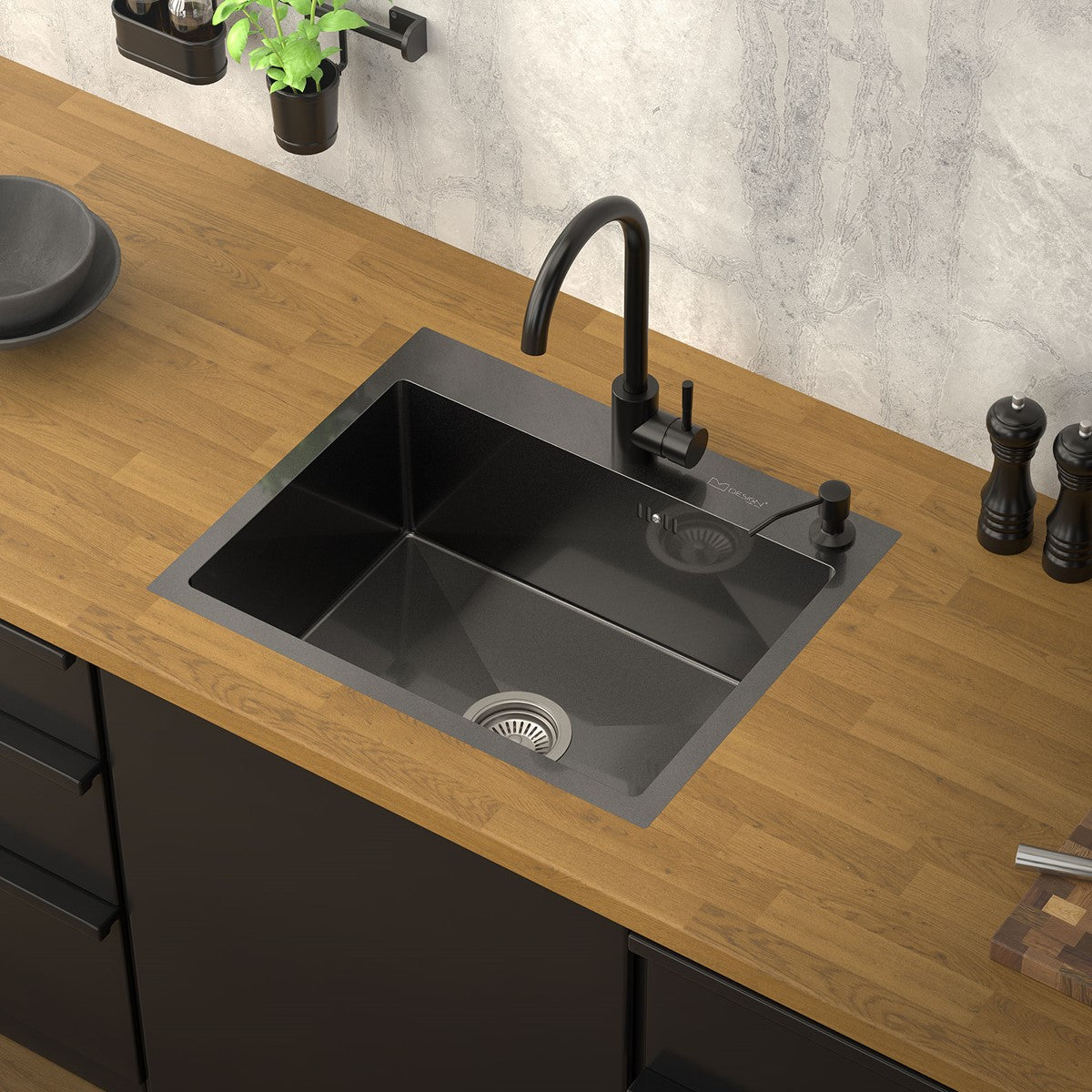 Black sink in a modern kitchen with a wooden countertop.