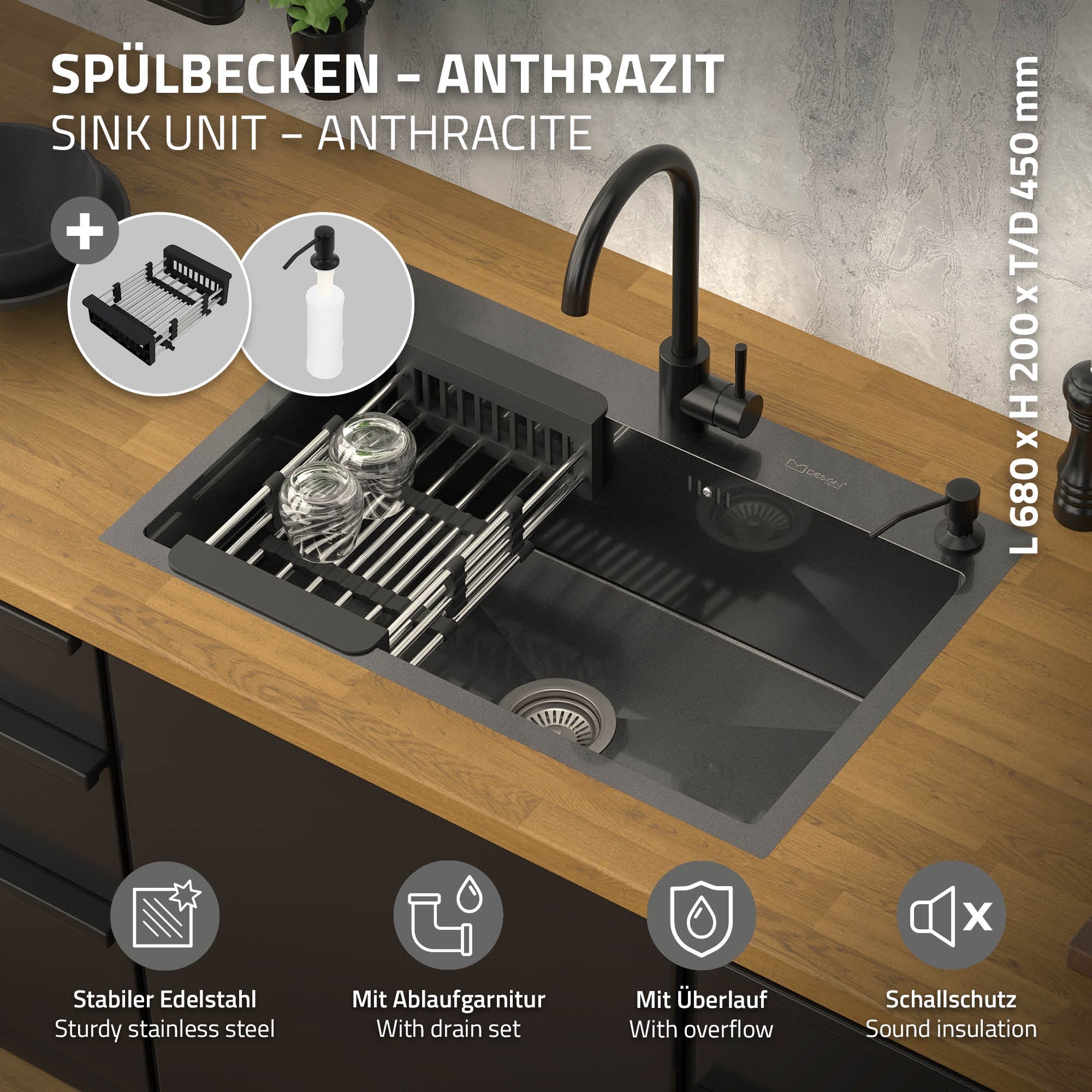 Spülbecken in Anthrazit mit Zubehör auf Holzoberfläche.