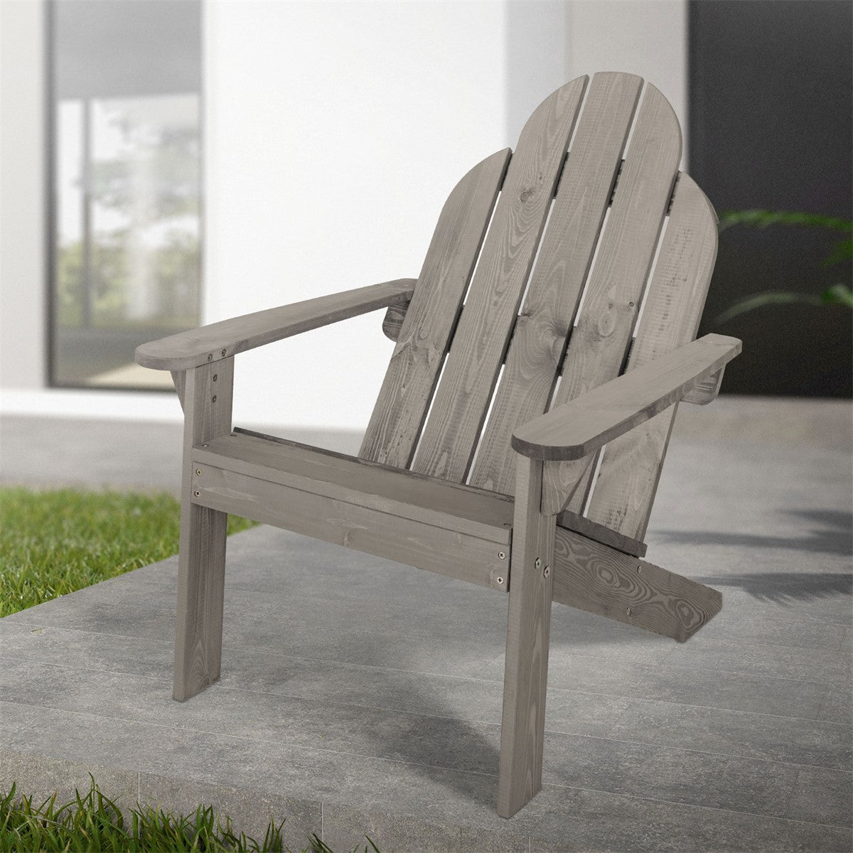 Wooden chair on a gray floor in front of a modern building.