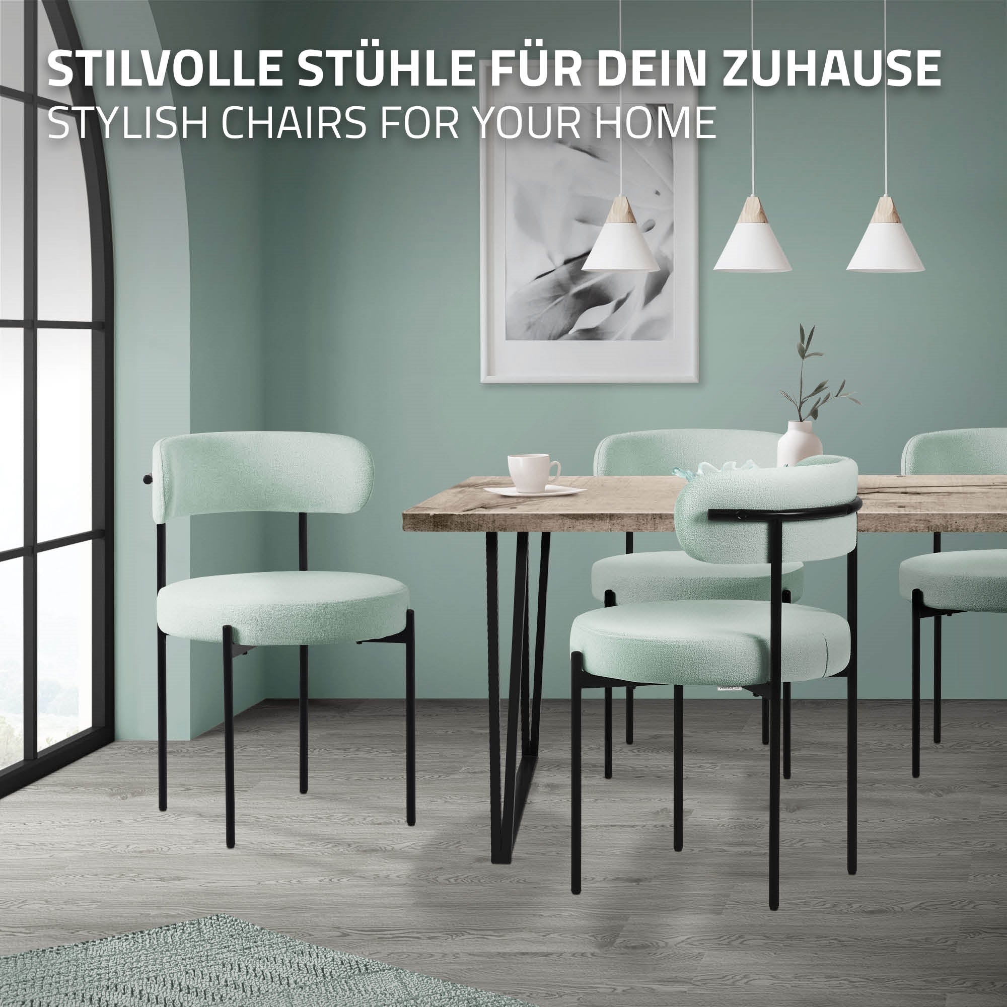 A room with a table and several mint green chairs on a wooden floor.
