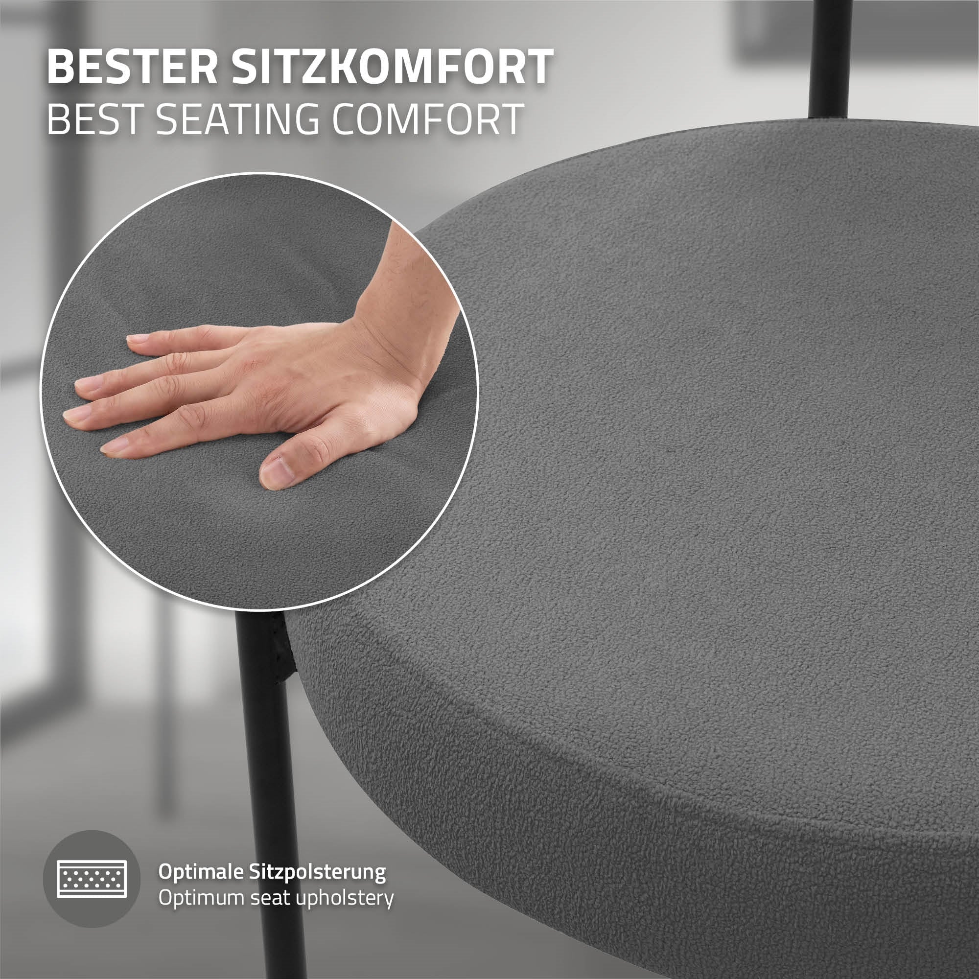 Grauer Stuhl mit Hand auf der Sitzfläche, die den Komfort zeigt.