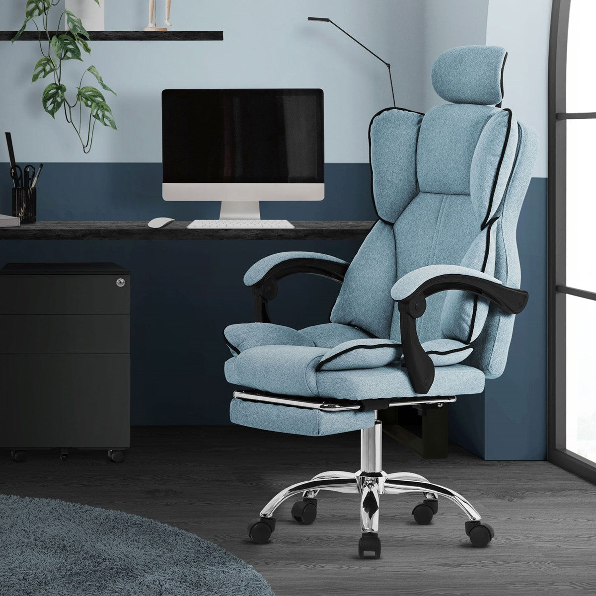 Blue office chair placed in a modern office with a desk.
