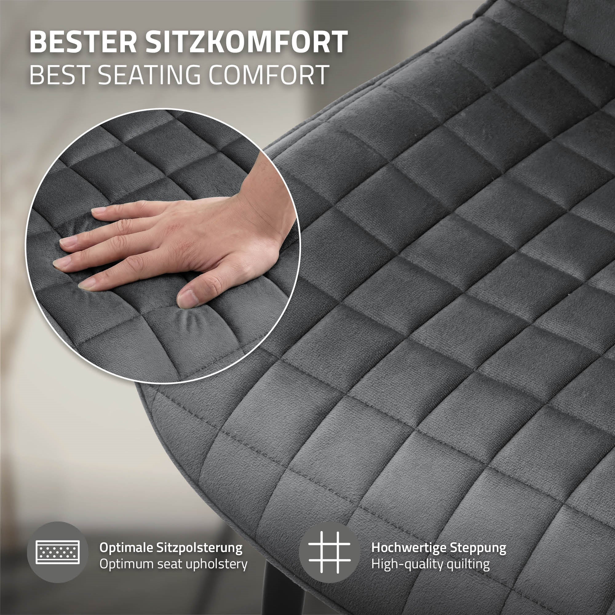Nahaufnahme eines grauen Stuhls mit gepolsterter Sitzfläche und hochwertiger Steppung.