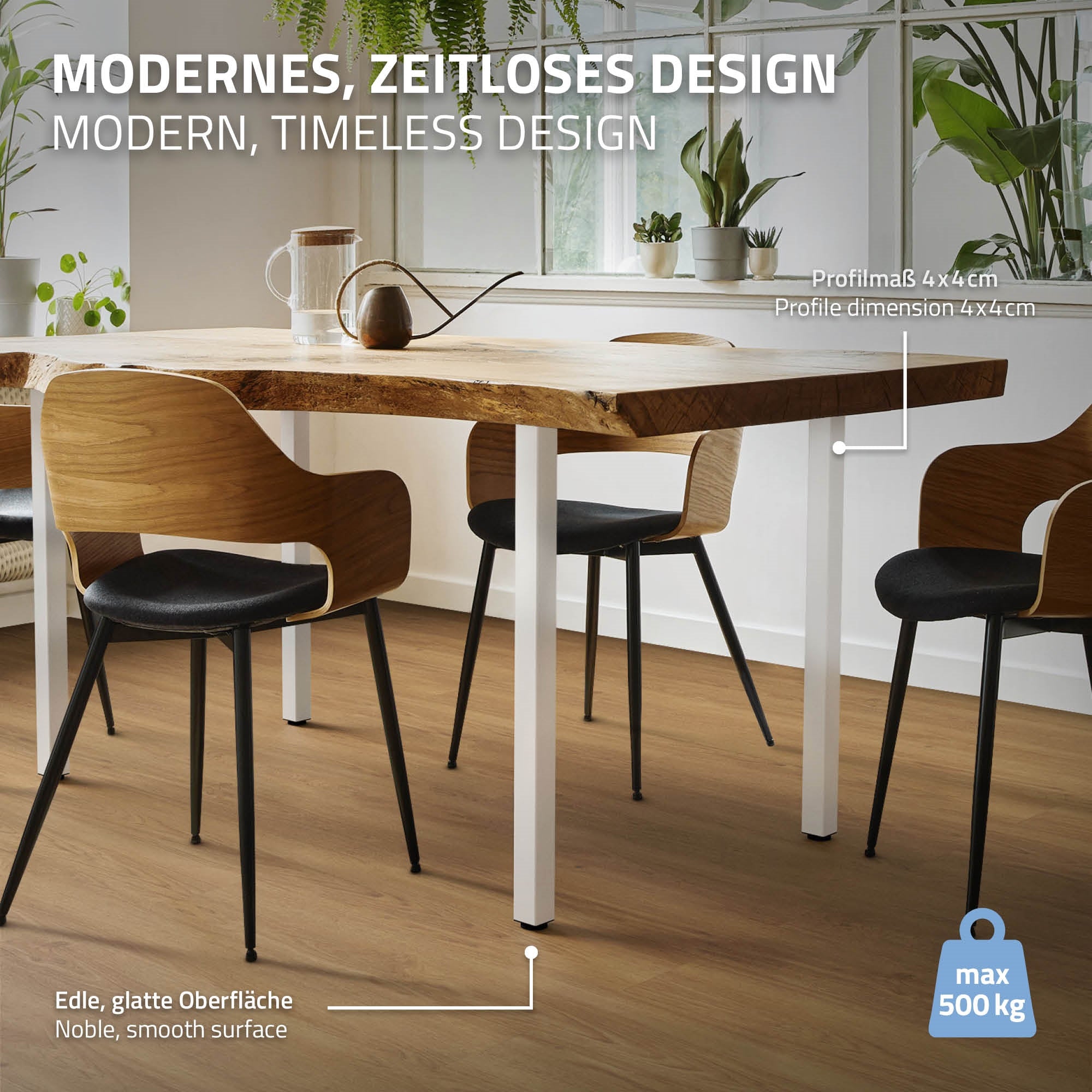 Wooden table with chairs in a room, plants in the background.