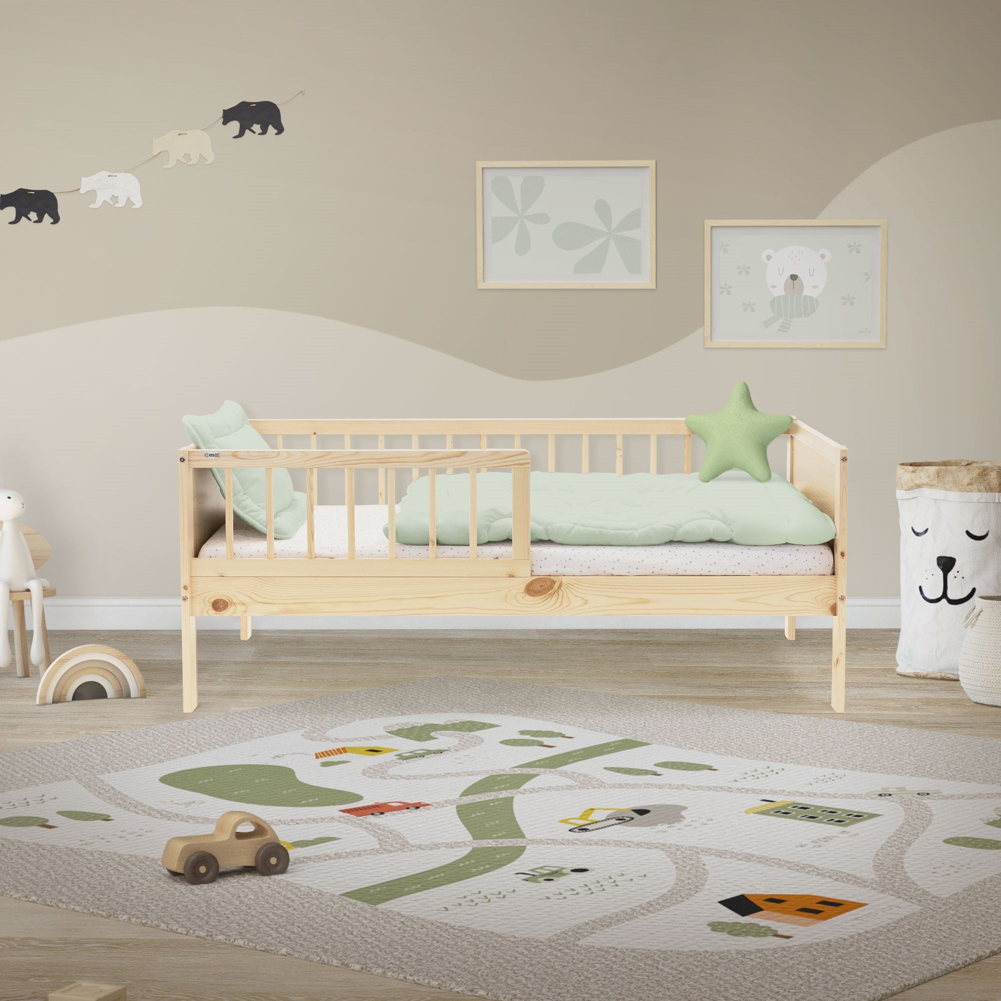 A children's room with a bed, carpet, and wall decoration.