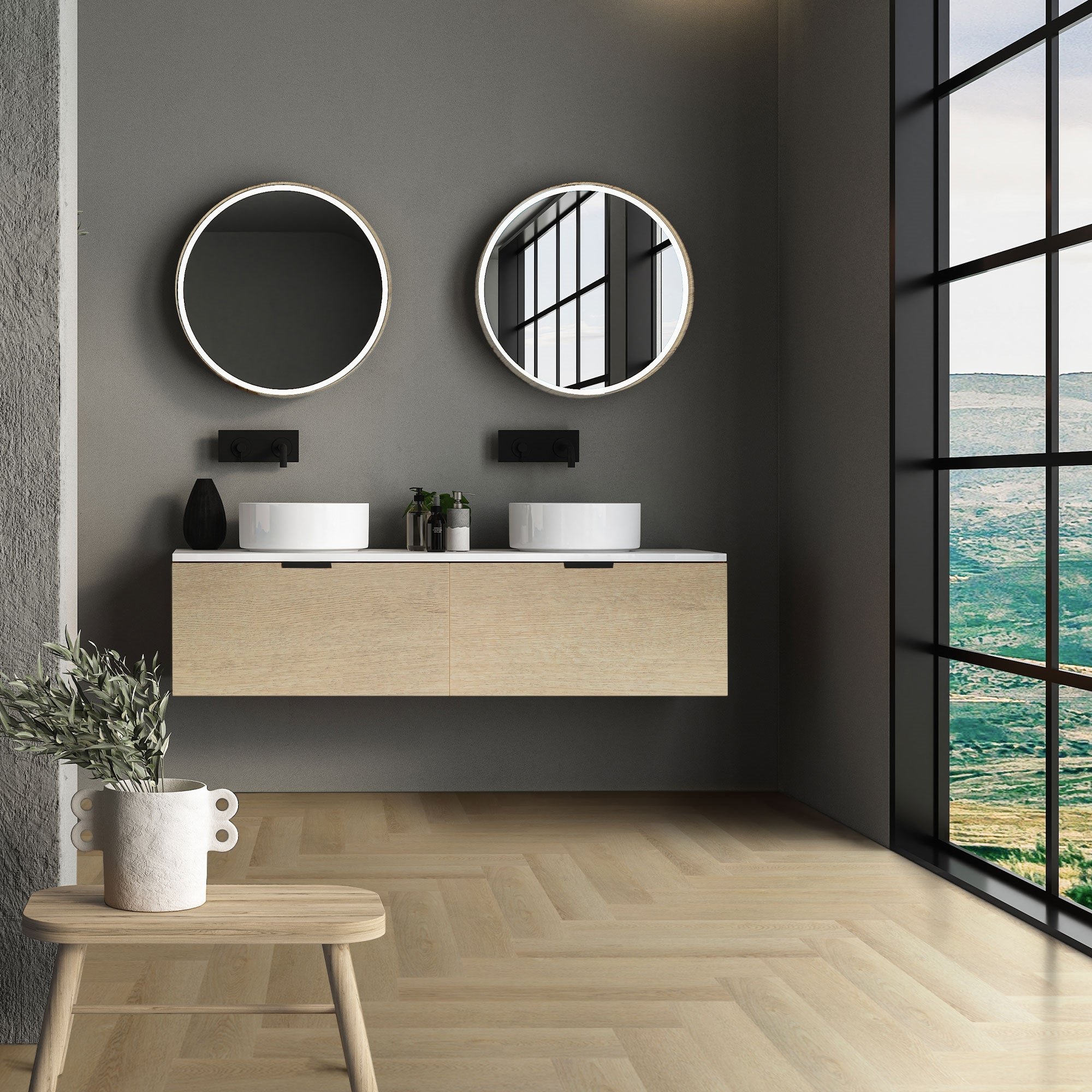 Bagno moderno con due specchi rotondi e due lavandini su un mobile in legno.