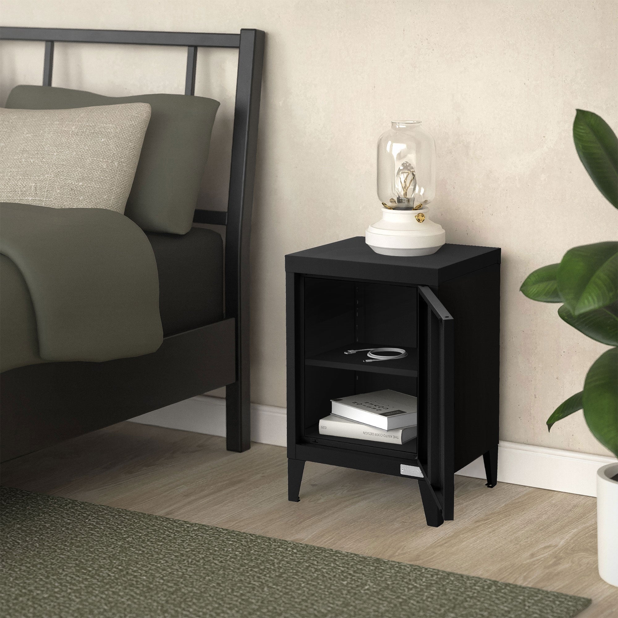 Black nightstand next to a bed, with a lamp and items on the shelf.
