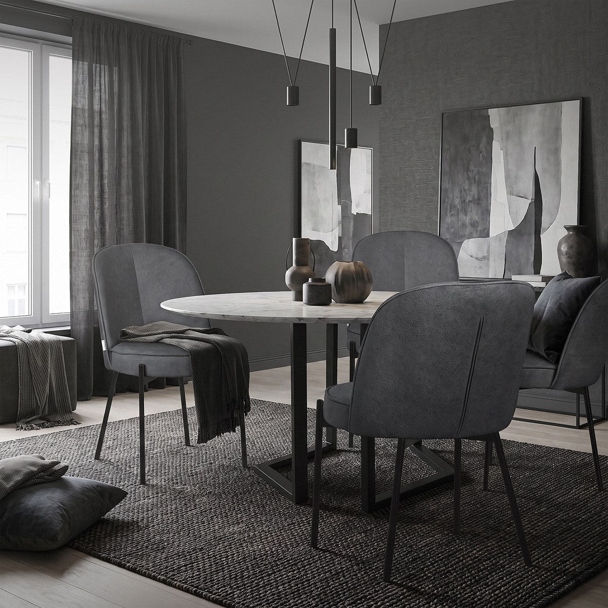 Sale da pranzo moderne con sedie grigie, un tavolo rotondo e decorazioni minimaliste.